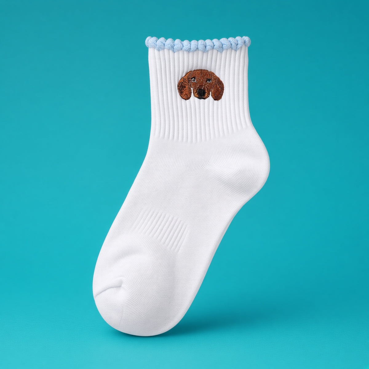 White cotton socks with a red dachshund embroidered on the cuff